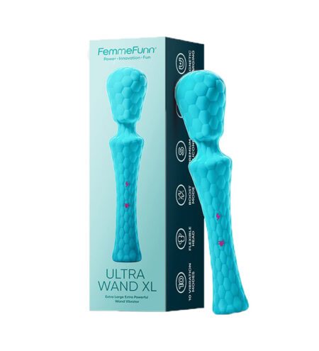 Waterproof turquoise wand vibrator standing leaning on a box