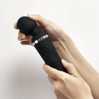 Hand showing the flexibility of the head of a black Lovense Domi 2 bluetooth app controlled wand vibrator