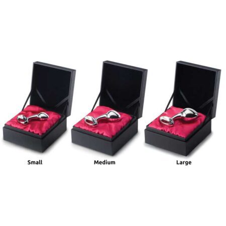 Three boxes of stainless steel nJoy butt plugs opened up to show the small, medium, and large sizes