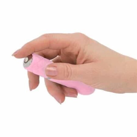 Hand pushing the button of a pink Pillow Talk Flirty bullet vibrator