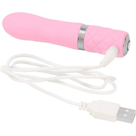 Pink Pillow Talk Flirty bullet vibrator with it's USB charging cable on a white background