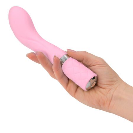 Hand holding a Pillow Talk Sassy g-spot vibrator