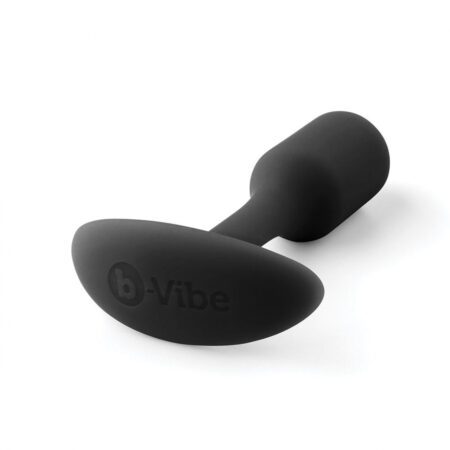 Small sized, black Snug Plug butt plug covered withÂ  silicone laying down on a white background