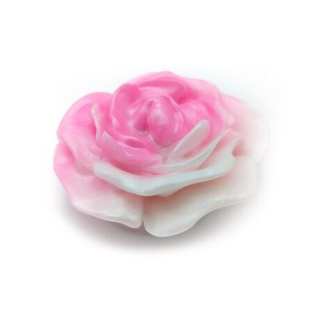 Pink rose shaped silicone grinder from Uberrime on a white background