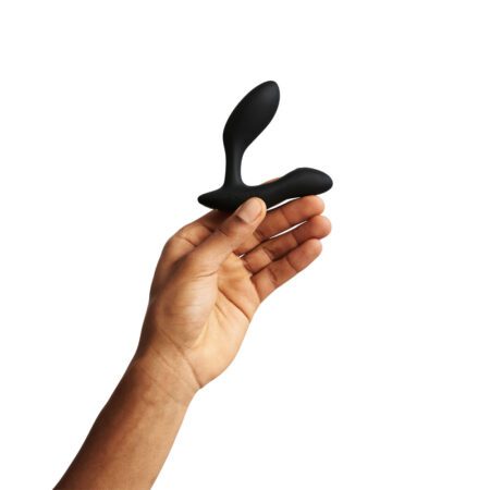 Hand holding the We Vibe Vector Plus prostate massager