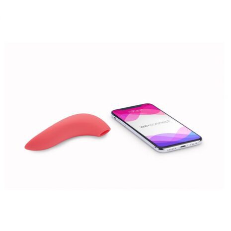 Pink We-Vibe Melt bluetooth and app controlled air pulse and suction vibrator sitting next to a smart phone with the We Connect app displayed