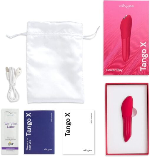 Cherry red colored We-Vibe Tango X bullet vibrator and all the contents of the box including charging cable, instruction manual, lube and storage bag