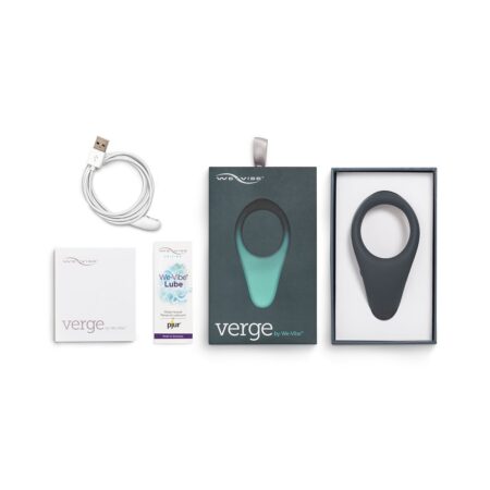 Slate colored We-Vibe Verge cock ring vibrator inside the box with charging cable, instruction manual and lube