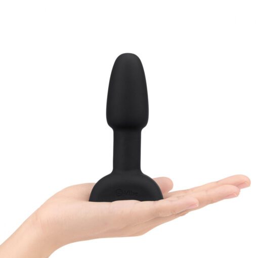 Hand holding a BlackÂ BVibe Rimming Plug petite