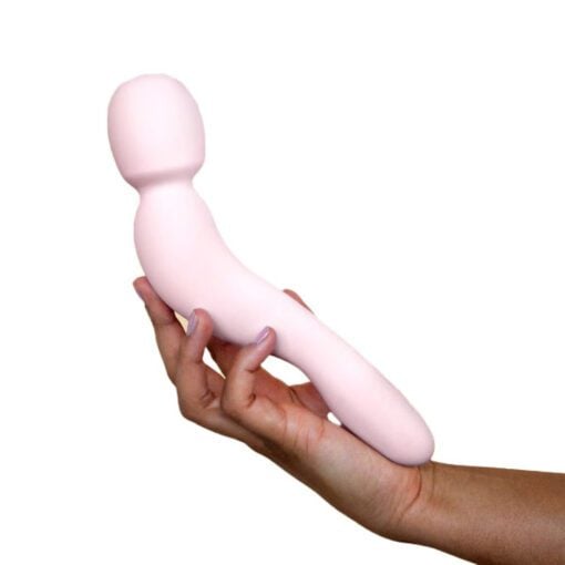 Handing holding Dame Com Wand Vibrator in Quartz