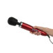 Hand holding the red doxy die cast wand vibrator