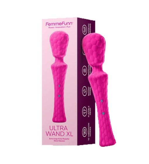 Waterproof pinkÂ Â wand vibrator standing leaning on a box