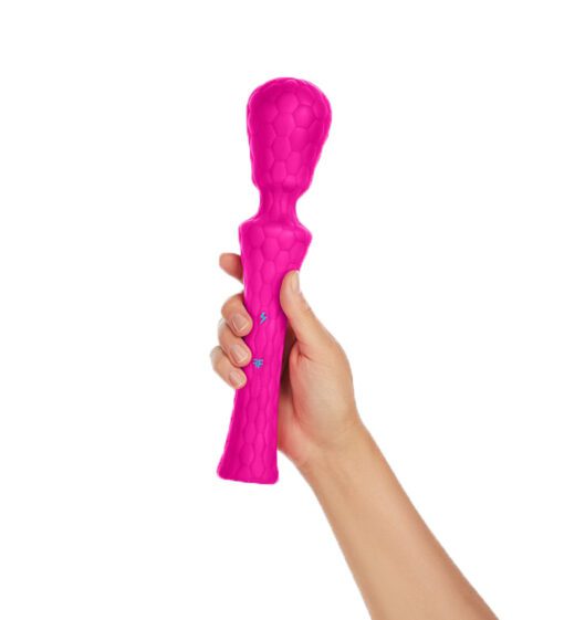 Hand holding a waterproof pinkÂ Â wand vibratorÂ 