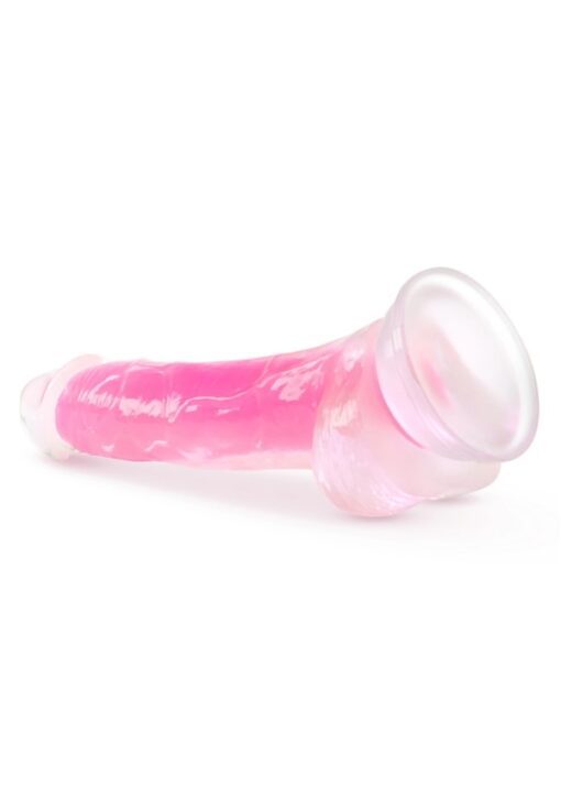 Neo Elite 7.5" Glow in the dark pink dildo on side facing left