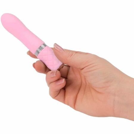 Hand holding a pink Pillow Talk Flirty bullet vibrator