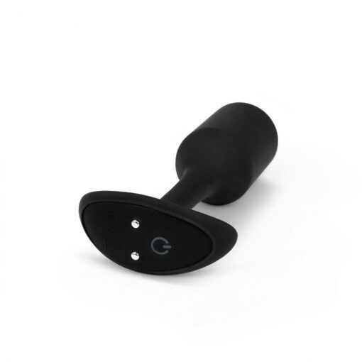 A side view of the black B-vibe snug plug showing the power charging terminal