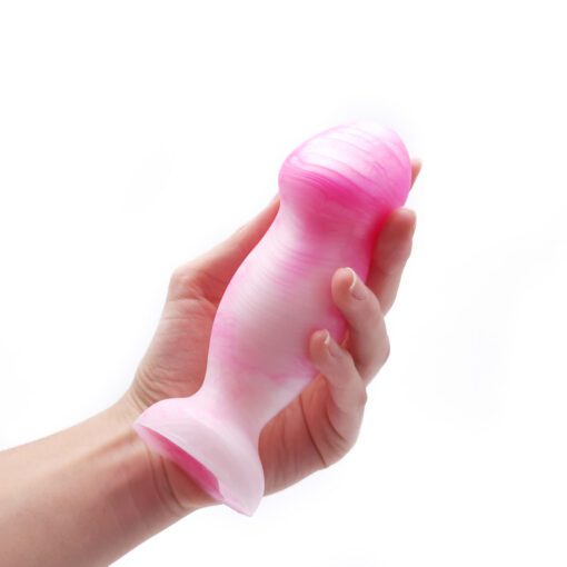 Hand holding Uberrime Sensi Vaginal Plug Pink Pearl