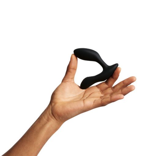 Hand holding the We Vibe Vector Plus prostate massager