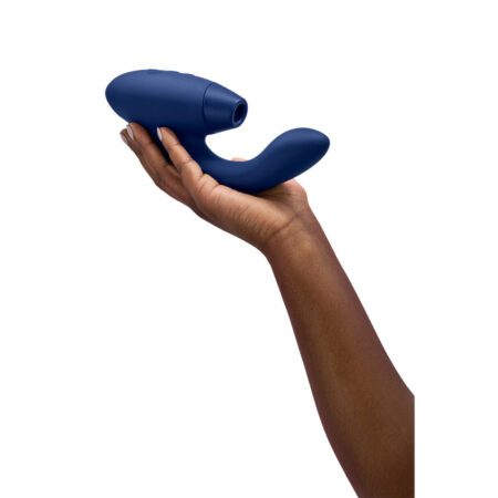 Hand holding the Womanizer Duo Vibrator in Blue