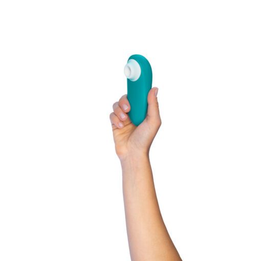 Hand holding the TurquoiseÂ Womanizer Starlet 3Â Air Pulse Vibrator